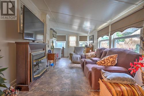 57 Circle Drive, Kawartha Lakes, ON - Indoor Photo Showing Living Room With Fireplace