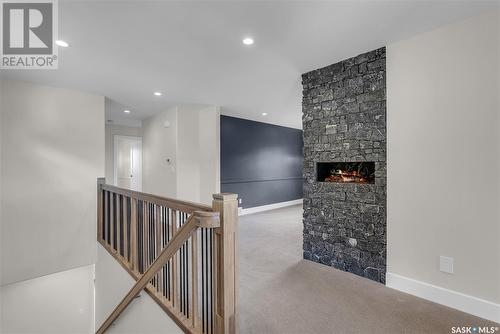 322 Dagnone Crescent, Saskatoon, SK - Indoor Photo Showing Other Room With Fireplace