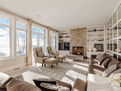 Living room - 2 Cours St-Lawrence, Dorval, QC - Indoor Photo Showing Living Room With Fireplace