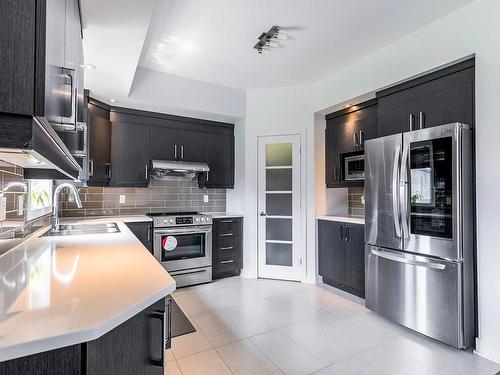 Cuisine - 7925 Rue De Lausanne, Brossard, QC - Indoor Photo Showing Kitchen With Double Sink With Upgraded Kitchen