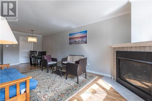 110 - 5 Jacksway Crescent, London, ON - Indoor Photo Showing Living Room With Fireplace