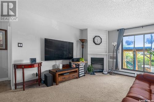 #103 315 Kingsmere Boulevard, Saskatoon, SK - Indoor Photo Showing Living Room With Fireplace