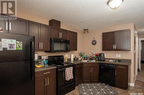 A & B 158 Toronto Street N, Regina, SK - Indoor Photo Showing Kitchen With Double Sink