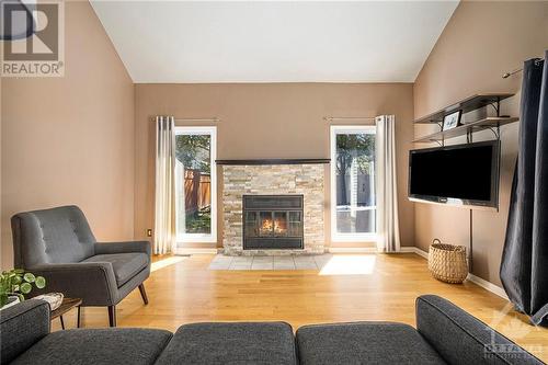 11 Wildbriar Way, Ottawa, ON - Indoor Photo Showing Living Room With Fireplace