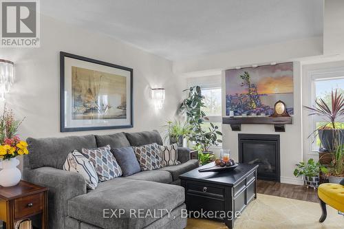 107 - 6 Anchorage Crescent, Collingwood, ON - Indoor Photo Showing Living Room With Fireplace