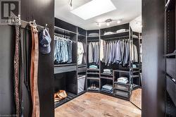 Principal bedroom with designer walk-in closet, skylight - 
