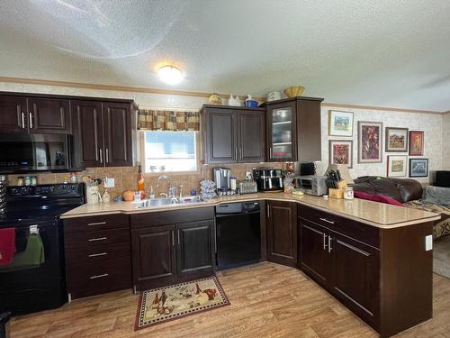 27 - 2905 Lower Six Mile Road, Nelson, BC - Indoor Photo Showing Kitchen With Double Sink