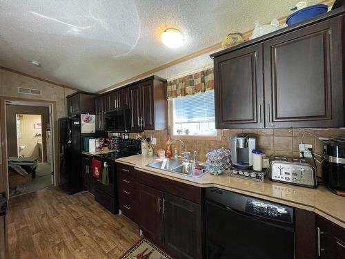 27 - 2905 Lower Six Mile Road, Nelson, BC - Indoor Photo Showing Kitchen With Double Sink