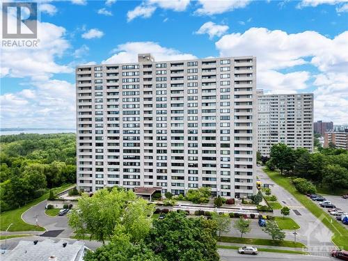 Great building with tons of visiotrs parking in the front. - 265 Poulin Avenue Unit#1411, Ottawa, ON - Outdoor With Facade