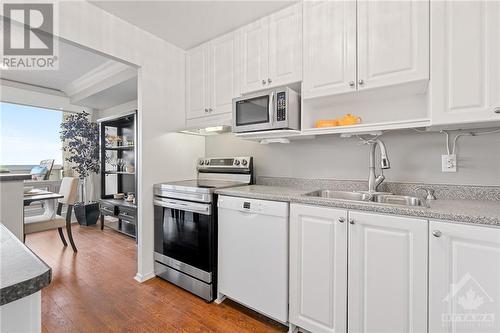 Great appliances including a dishwasher. - 265 Poulin Avenue Unit#1411, Ottawa, ON - Indoor Photo Showing Kitchen With Double Sink