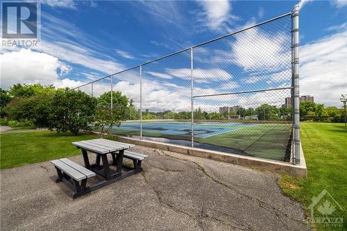 Outdoor tennis courts, and bbq area. - 265 Poulin Avenue Unit#1411, Ottawa, ON - Outdoor
