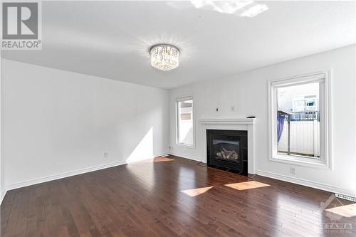 580 Sunlit Circle, Ottawa, ON - Indoor Photo Showing Living Room With Fireplace