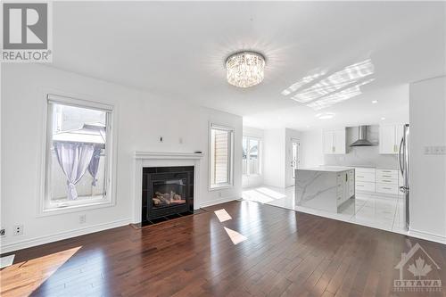 580 Sunlit Circle, Ottawa, ON - Indoor Photo Showing Living Room With Fireplace