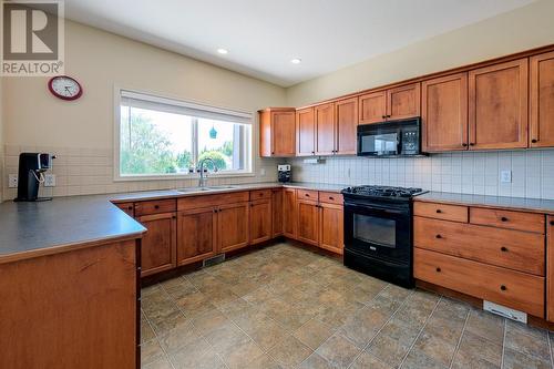 2250 Shannon Hills Place, West Kelowna, BC - Indoor Photo Showing Kitchen With Double Sink