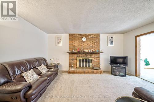 1076 Huntingwood Drive, Toronto, ON - Indoor Photo Showing Living Room With Fireplace