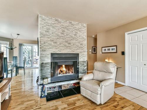 Living room - 50 Rue Achille, Saint-Sauveur, QC - Indoor Photo Showing Living Room With Fireplace