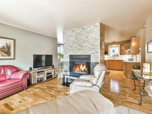 Living room - 50 Rue Achille, Saint-Sauveur, QC - Indoor Photo Showing Living Room With Fireplace