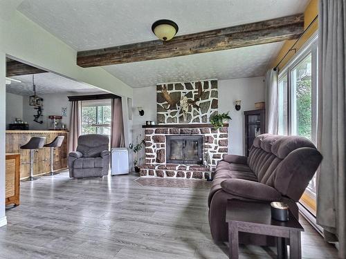 Living room - 326 Route 101 S., Duhamel-Ouest, QC - Indoor Photo Showing Living Room With Fireplace