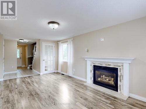 86 Wessenger Drive, Barrie, ON - Indoor Photo Showing Living Room With Fireplace