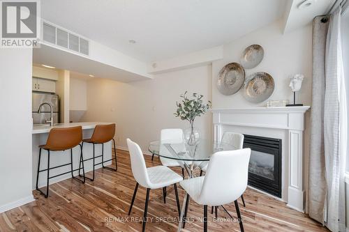 1021 - 18 Laidlaw Street, Toronto, ON - Indoor Photo Showing Dining Room With Fireplace