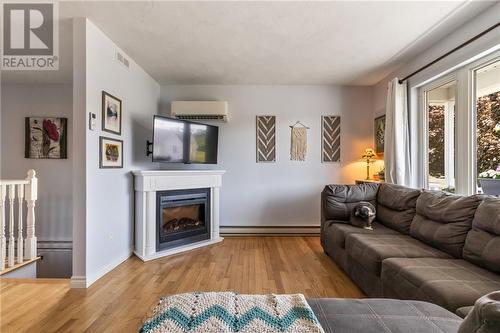 441 Louis St, Dieppe, NB - Indoor Photo Showing Living Room With Fireplace