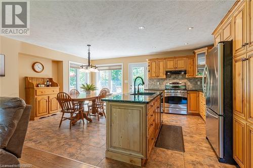 Updated Kitchen, Luxury Vinyl Floor, Live Edge Granite Countertops. - 98 Birch Street, South Bruce Peninsula, ON - Indoor Photo Showing Kitchen