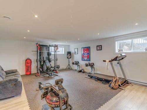 Family room - 101 Rue Georges-Estu, Lavaltrie, QC - Indoor Photo Showing Gym Room