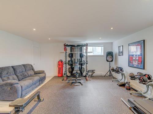 Family room - 101 Rue Georges-Estu, Lavaltrie, QC - Indoor Photo Showing Gym Room