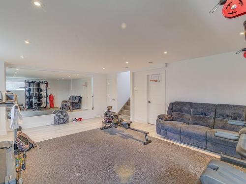 Family room - 101 Rue Georges-Estu, Lavaltrie, QC - Indoor Photo Showing Gym Room