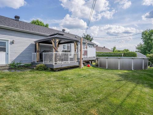 Back facade - 641 162E Rue, Saint-Georges, QC - Outdoor With Above Ground Pool With Deck Patio Veranda