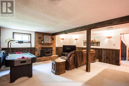 1417 Gill Road, Springwater (Midhurst), ON - Indoor With Fireplace