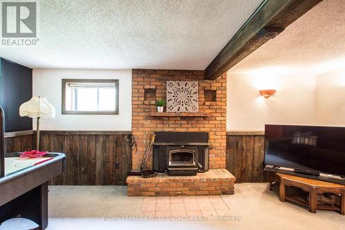 1417 Gill Road, Springwater (Midhurst), ON - Indoor With Fireplace