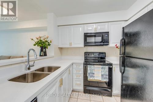 506 - 7 Michael Power Place, Toronto (Islington-City Centre West), ON - Indoor Photo Showing Kitchen With Double Sink