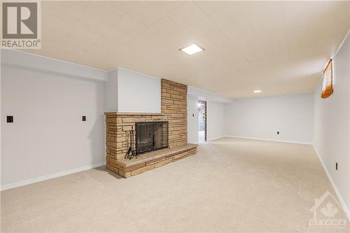 Fully Finished Basement with Wood Burning Fireplace - 2702 Traverse Drive, Ottawa, ON - Indoor With Fireplace