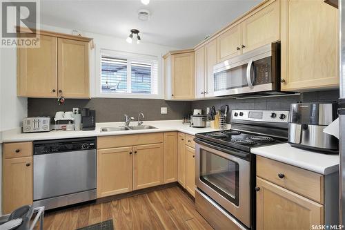 36 4640 Harbour Landing Drive, Regina, SK - Indoor Photo Showing Kitchen With Double Sink