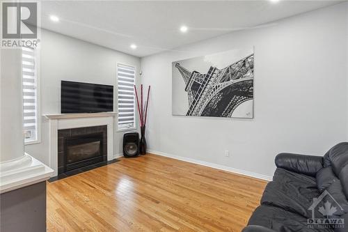 119 Macara Crescent, Ottawa, ON - Indoor Photo Showing Living Room With Fireplace