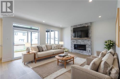 Virtually Staged - 1378 Fribourg Street, Embrun, ON - Indoor Photo Showing Living Room With Fireplace