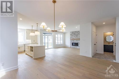 1378 Fribourg Street, Embrun, ON - Indoor Photo Showing Other Room With Fireplace