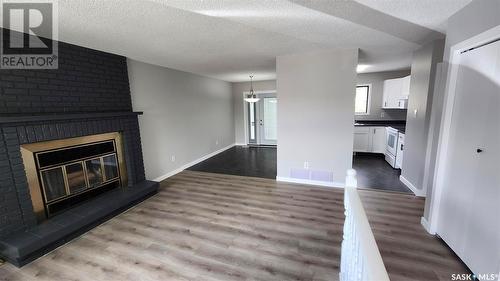 1110 Bayda Crescent, Regina, SK - Indoor Photo Showing Living Room With Fireplace
