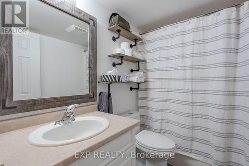 Bathroom in the lower level with custom shelves. - 22 Kristen Court, Middlesex Centre (Kilworth), ON - Indoor Photo Showing Bathroom