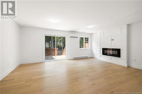 169 Elsliger Street, Dieppe, NB - Indoor Photo Showing Living Room With Fireplace