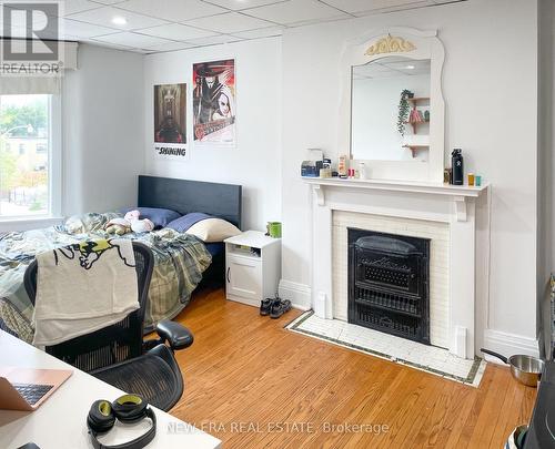 817 Bloor Street W, Toronto (Palmerston-Little Italy), ON - Indoor Photo Showing Bedroom With Fireplace