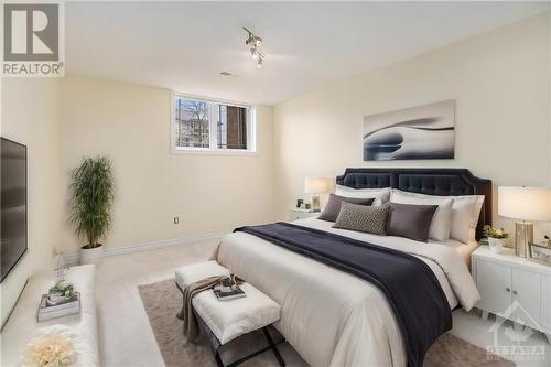 This photo has been virtually staged. - 58 Brentmore Private, Ottawa, ON - Indoor Photo Showing Bedroom