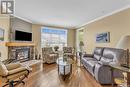 304 218 Heath Avenue, Saskatoon, SK  - Indoor Photo Showing Living Room With Fireplace 