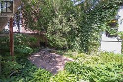 Apt 1 private fenced south-face backyard - 