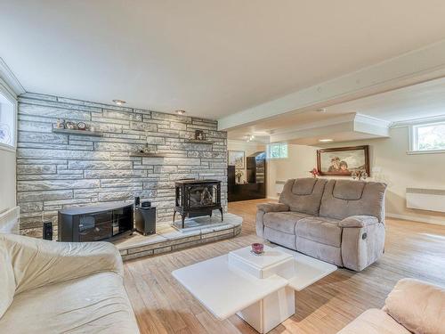 Basement - 3261 Rue Carmina, Laval (Fabreville), QC - Indoor Photo Showing Living Room With Fireplace