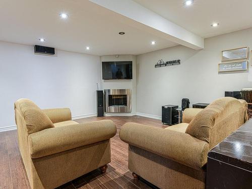 Family room - 11 Rue Daubigny, Candiac, QC - Indoor Photo Showing Basement With Fireplace