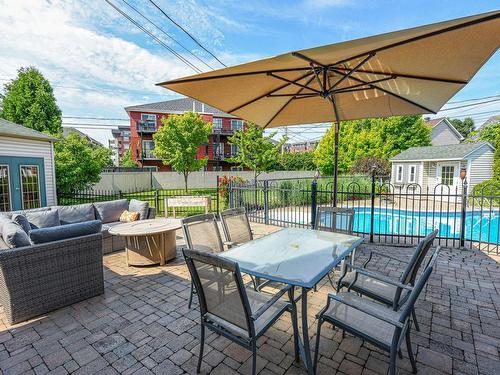 Backyard - 11 Rue Daubigny, Candiac, QC - Outdoor With In Ground Pool With Deck Patio Veranda With Exterior