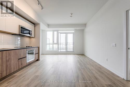 705 - 150 Logan Avenue, Toronto, ON - Indoor Photo Showing Kitchen