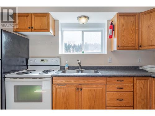 683 San Michelle Road, Kelowna, BC - Indoor Photo Showing Kitchen With Double Sink